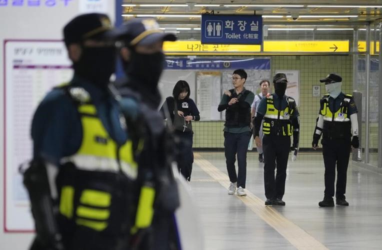 South Korea detains suspect in high school teacher's stabbing a day after separate attack wounded 14