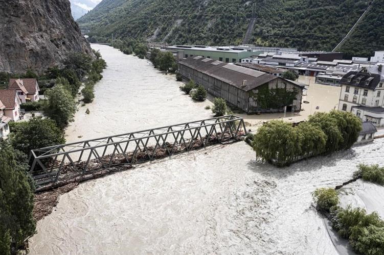 Storms in Switzerland cause flooding and a landslide that left at least 2 people dead