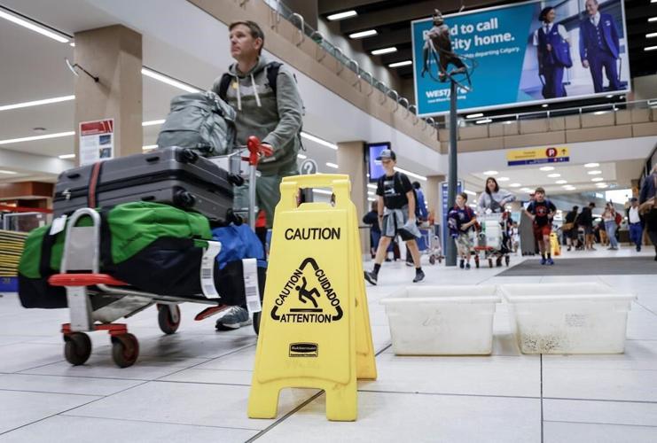 Traveller describes pouring water, falling ceiling tile at storm-hit Calgary airport