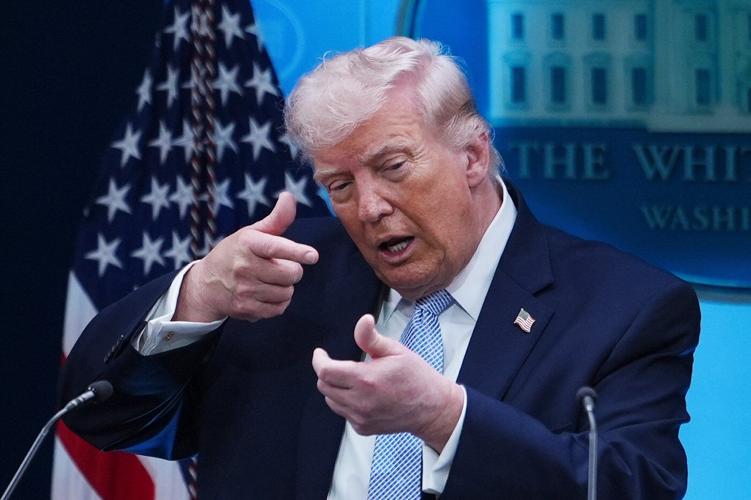 Photos of Trump's Monday, talking Iran at Easter Egg Roll and mimicking a sniper in the press room