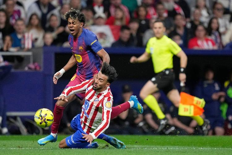 Barcelona overcomes 10-man Atletico and boosts La Liga lead after Real Madrid loses