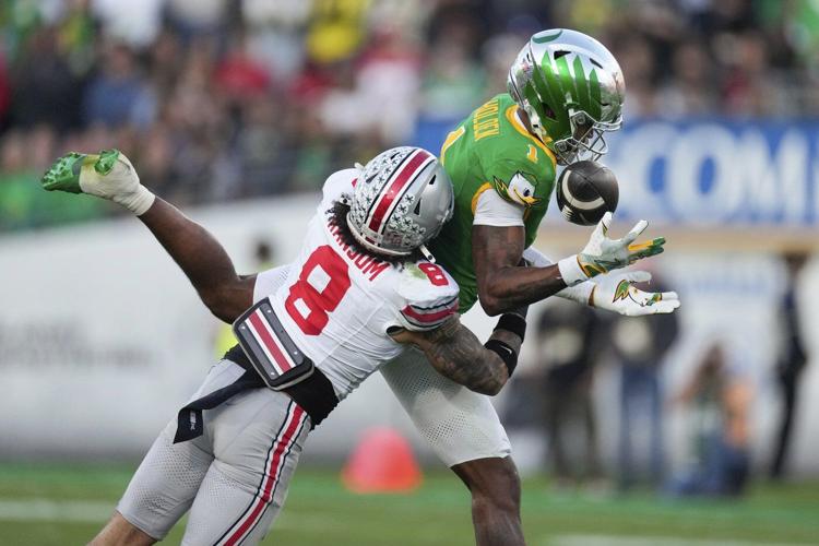 No. 6 Ohio State blasts top-ranked Oregon 41-21 in the Rose Bowl, advances to CFP semifinals