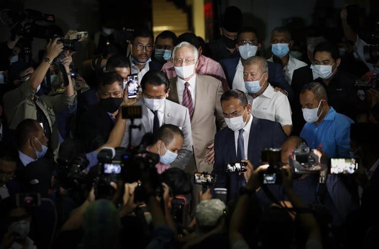 Malaysia halves prison term for ex-Prime Minister who oversaw multibillion-dollar 1MDB thefts