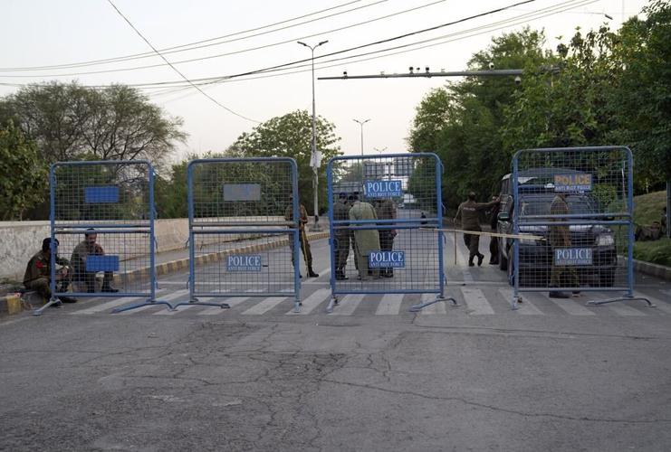 Pakistan's Imran Khan dials down campaign of defiance, allows police search of home for suspects