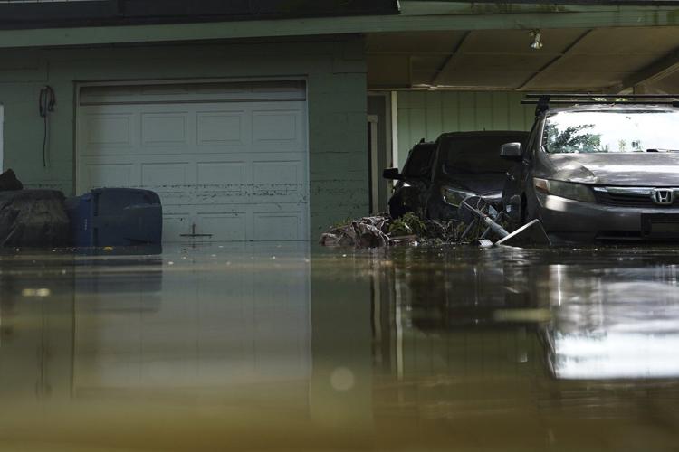 At least 6 people have died from days of storms and record-setting flooding in Indiana