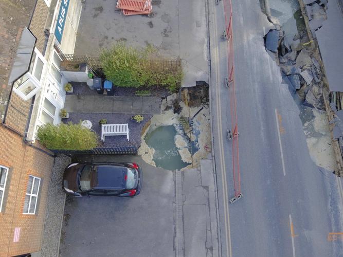 Sinkhole opens up on the main street of an English village