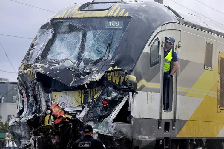 Train collides with fire truck in Florida. Police say 3 firefighters and at least 12 passengers hurt