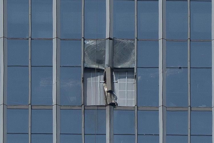 Small plane crash at Beijing high-rise kills the pilot and injures 13, authorities say