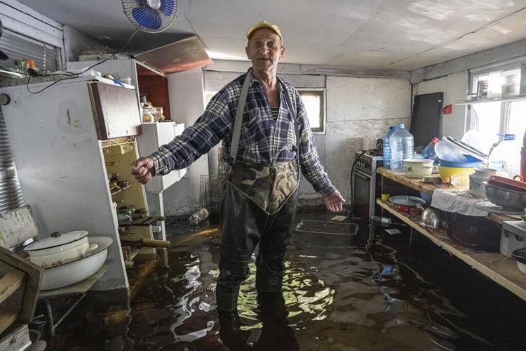 Damage to Russian-occupied dam submerges Ukrainian reservoir island community