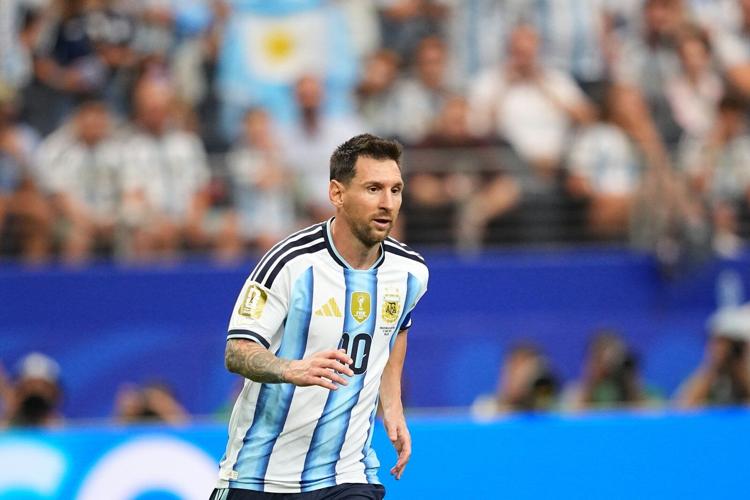 Messi sets World Cup scoring record as defending champion Argentina advances to knockout stage