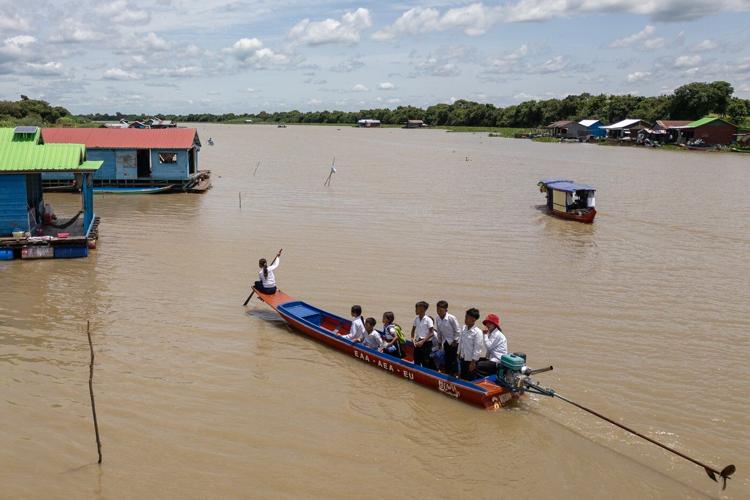Photos show Cambodian children attend school in floating villages along the Tonle Sap lake.