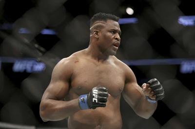 Heavyweight boxing champ Fury survives scare from former UFC fighter Ngannou to win split decision