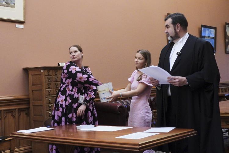 In New Zealand's Parliament, a battered cookie tin decides which new laws get debated