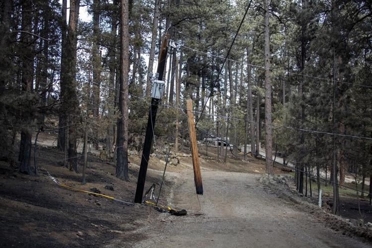 Team combs fire-ravaged New Mexico community for remains of the missing
