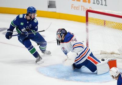 Hughes helps Canucks power past Oilers 5-2