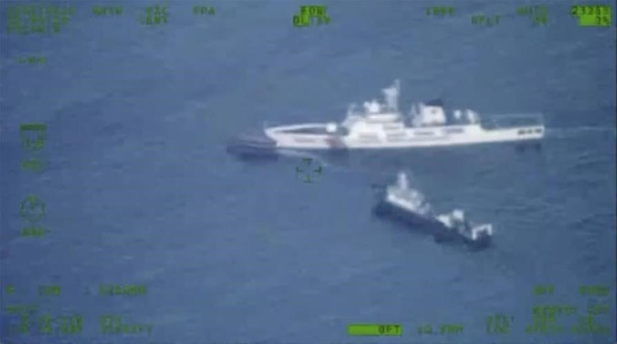Philippines says a coast guard ship and supply boat were rammed by Chinese vessels at disputed shoal