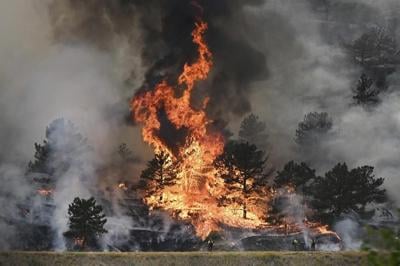 A Colorado man is charged with arson in a wildfire that destroyed 29 homes