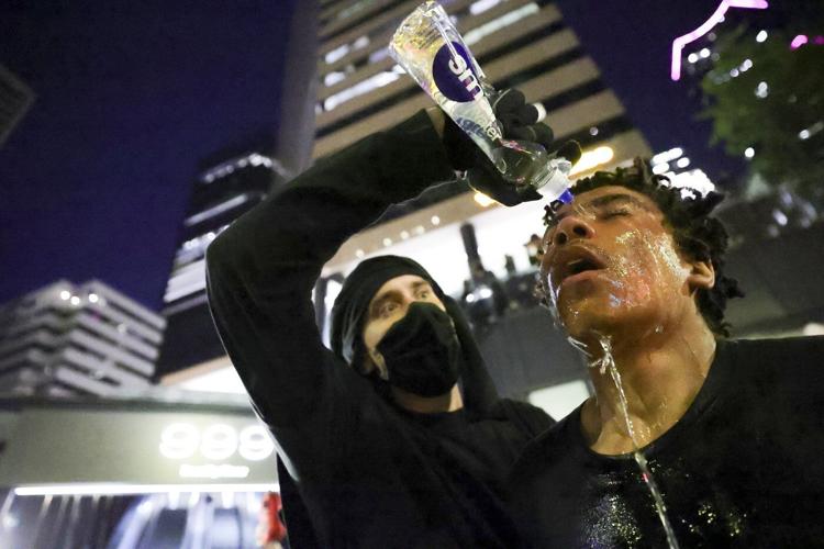 AP PHOTOS: Protests surge across US after Trump mobilizes troops