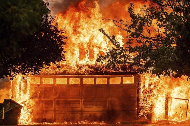 A wildfire sweeps through a historic California gold-mining town in photos