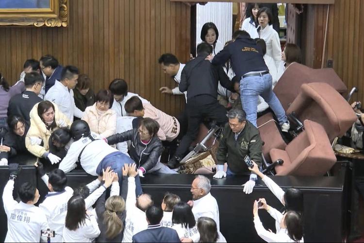 Taiwan lawmakers clash after one party breaks into legislature to occupy speaker's chair