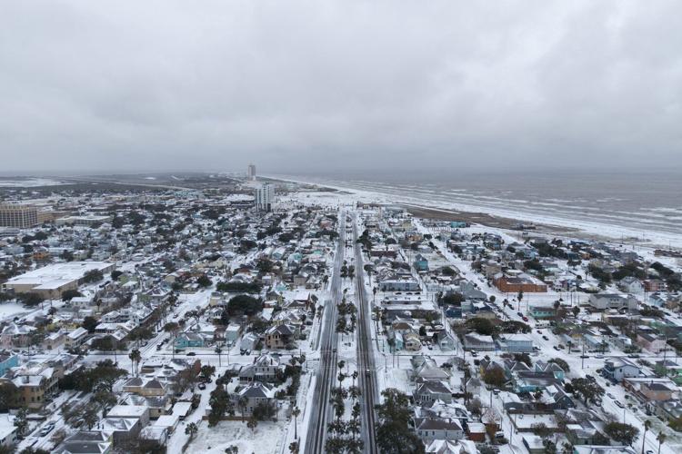 Winter storm that dropped record-breaking snow in New Orleans spreads into Florida and the Carolinas