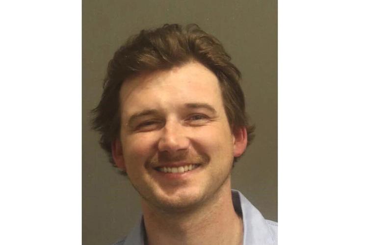 Morgan Wallen has been arrested after police say he threw a chair off of the roof of a 6-story bar