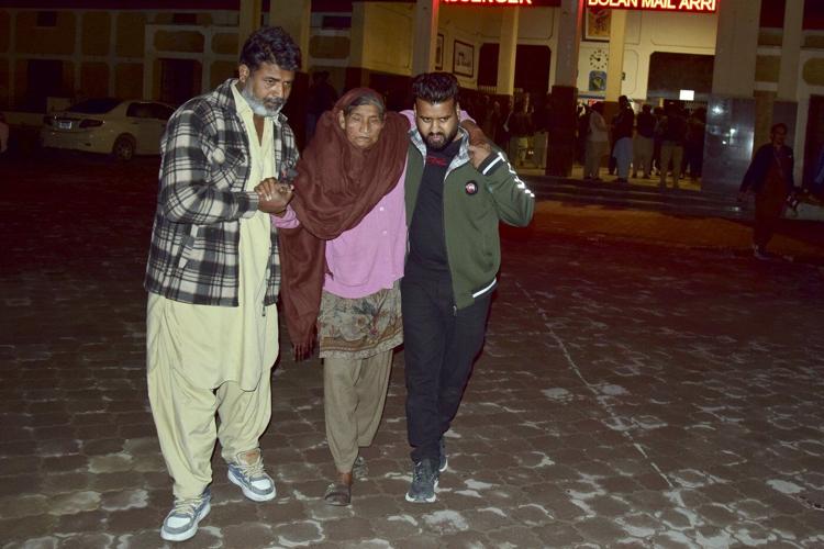 Pakistani security forces battle to free about 300 hostages aboard a hijacked train