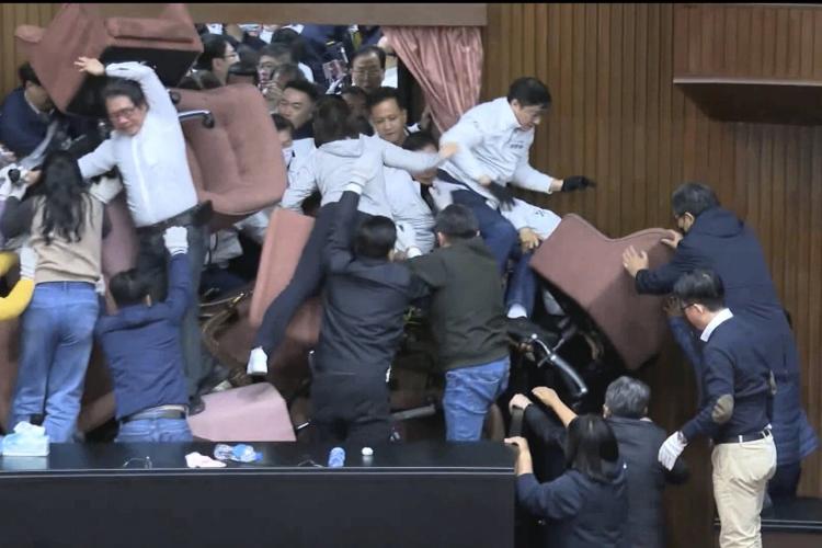 Taiwan lawmakers clash after one party breaks into legislature to occupy speaker's chair