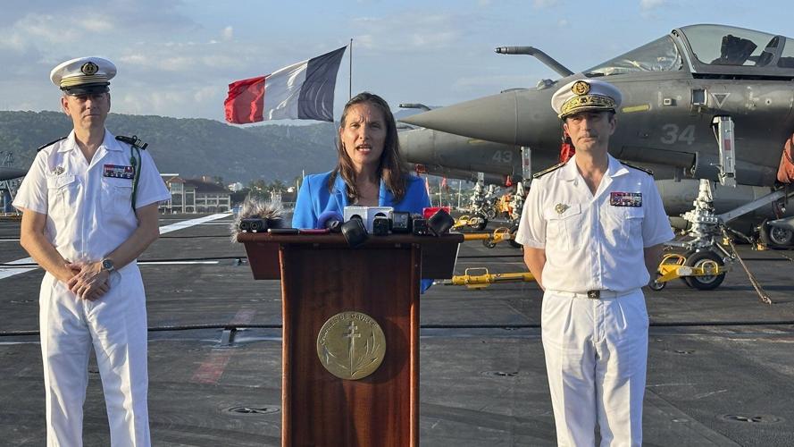 French aircraft carrier stages combat drills with Filipinos in disputed sea and visits Philippines