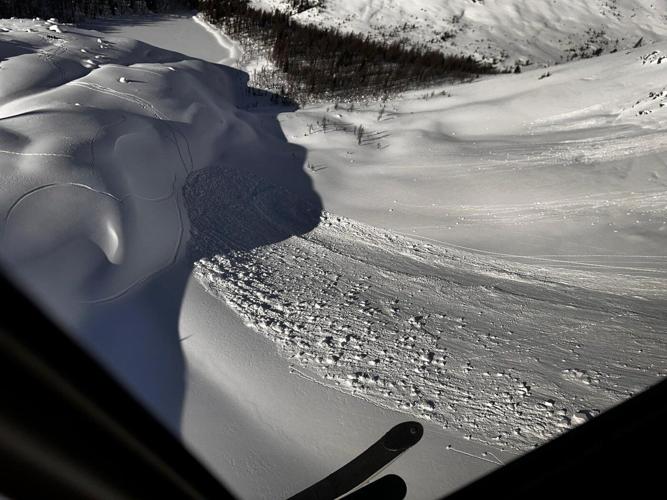 Skier buried up to waist after triggering backcountry avalanche in Alberta Rockies