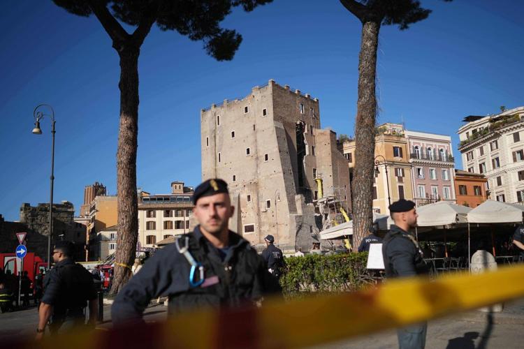 Rescuers work to reach worker trapped in medieval tower that partially collapsed in Rome
