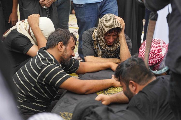 Officials try to identify 18 bodies in deadly Iraq shopping mall fire