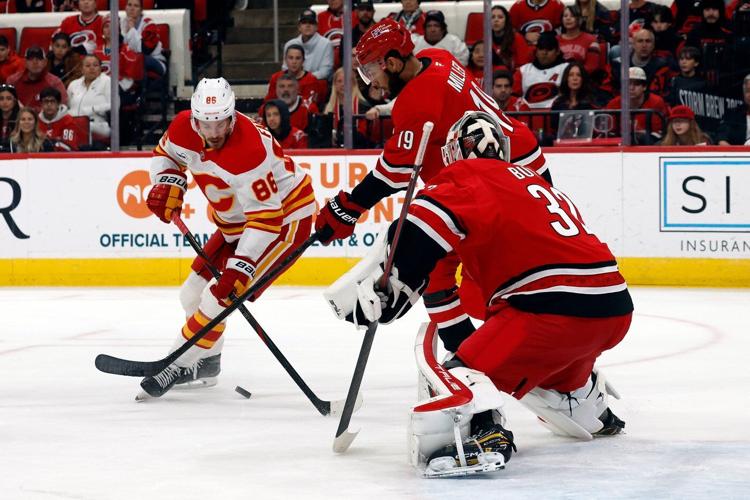 Bussi makes 15 saves for 1st NHL shutout, Ehlers scores in OT in Hurricanes' 1-0 win over Flames