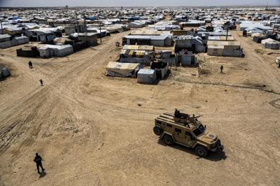 Syrian Kurdish officials hand over 50 women and children linked to Islamic State group to Tajikistan