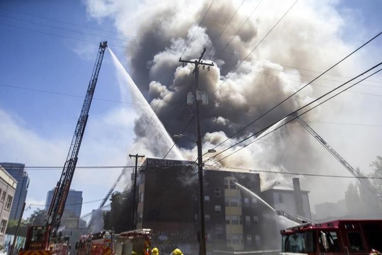 4 rescued in major fire in downtown Portland, Oregon, before firefighters pulled back as blaze rages