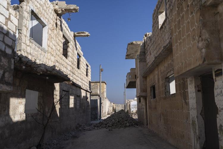 AP PHOTOS: In northern Syria, displaced owners return to houses with no roofs