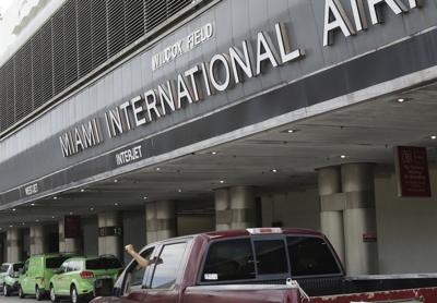Court records say a passenger attacked a flight attendant, swallowed rosary beads on plane to Miami