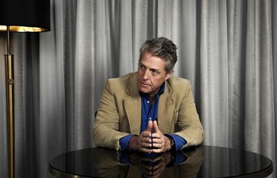 Hugh Grant spent half his career in rom-coms. Now he plays monsters, and he's never been happier