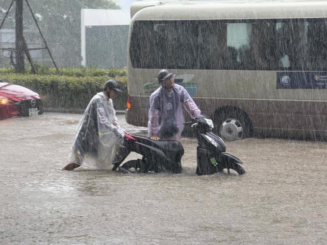 Heavy rain falls in parts of Southeast Asia after tropical storm blows into Vietnam