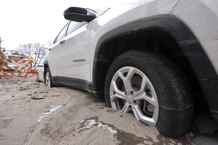 Detroit crews are working to fix a broken water main that flooded dozens of homes