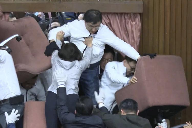 Taiwan lawmakers clash after one party breaks into legislature to occupy speaker's chair