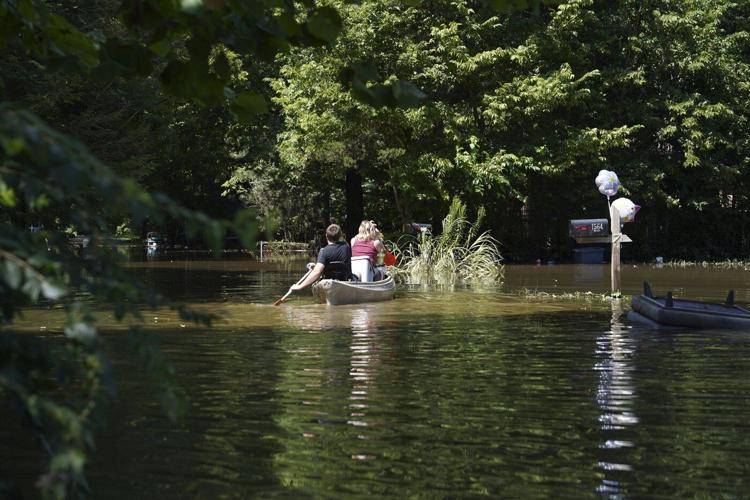 At least 6 people have died from days of storms and record-setting flooding in Indiana