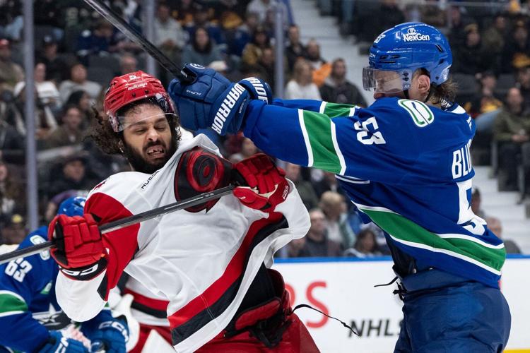 Beleaguered Vancouver Canucks show fight in loss to high-powered Carolina Hurricanes