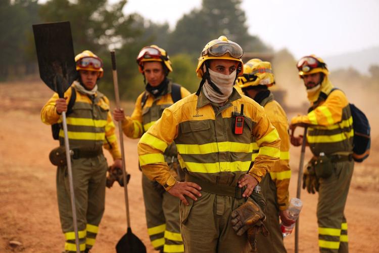 Firefighters battle one of Spain's biggest-ever wildfires during heat wave across the Mediterranean