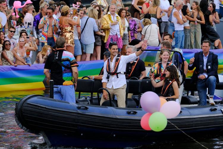 Hundreds of thousands line Amsterdam canals for the annual Pride boat parade