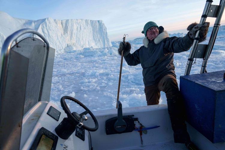 A Greenland sled dog champion fears for his culture as climate change melts the ice