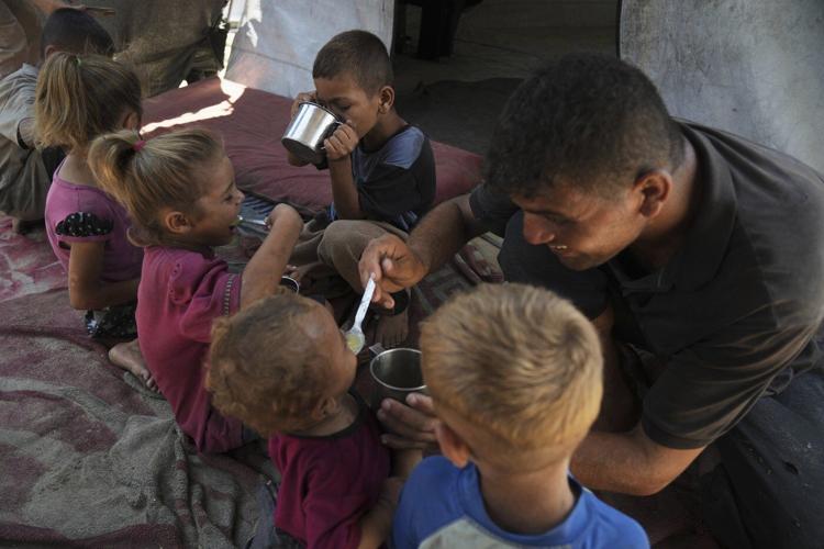 A day in the life, in photos, of one family's search for food in Gaza