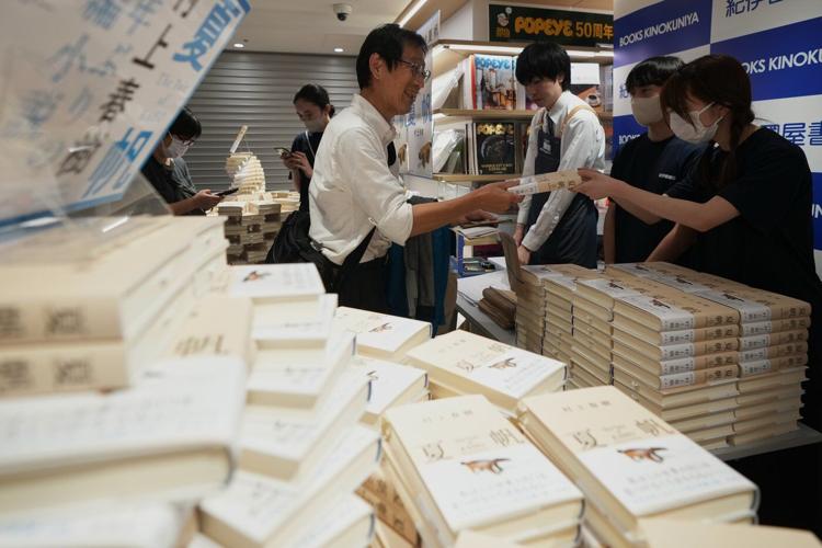 Fans mark the release of new Haruki Murakami novel at a midnight event in Tokyo