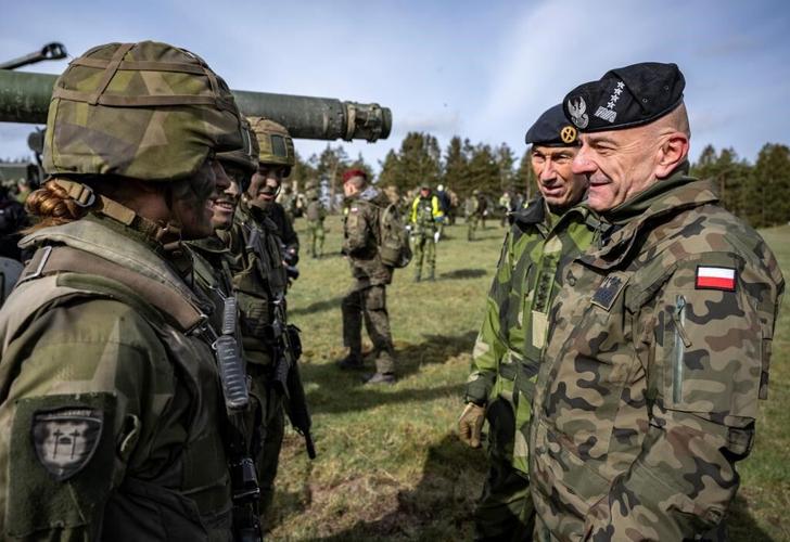 2 top Polish military commanders resign in a spat with the defense minister