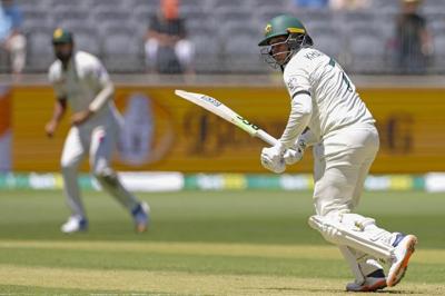 Australia cricketer Khawaja wears a black armband after a ban on his 'all lives are equal' shoes
